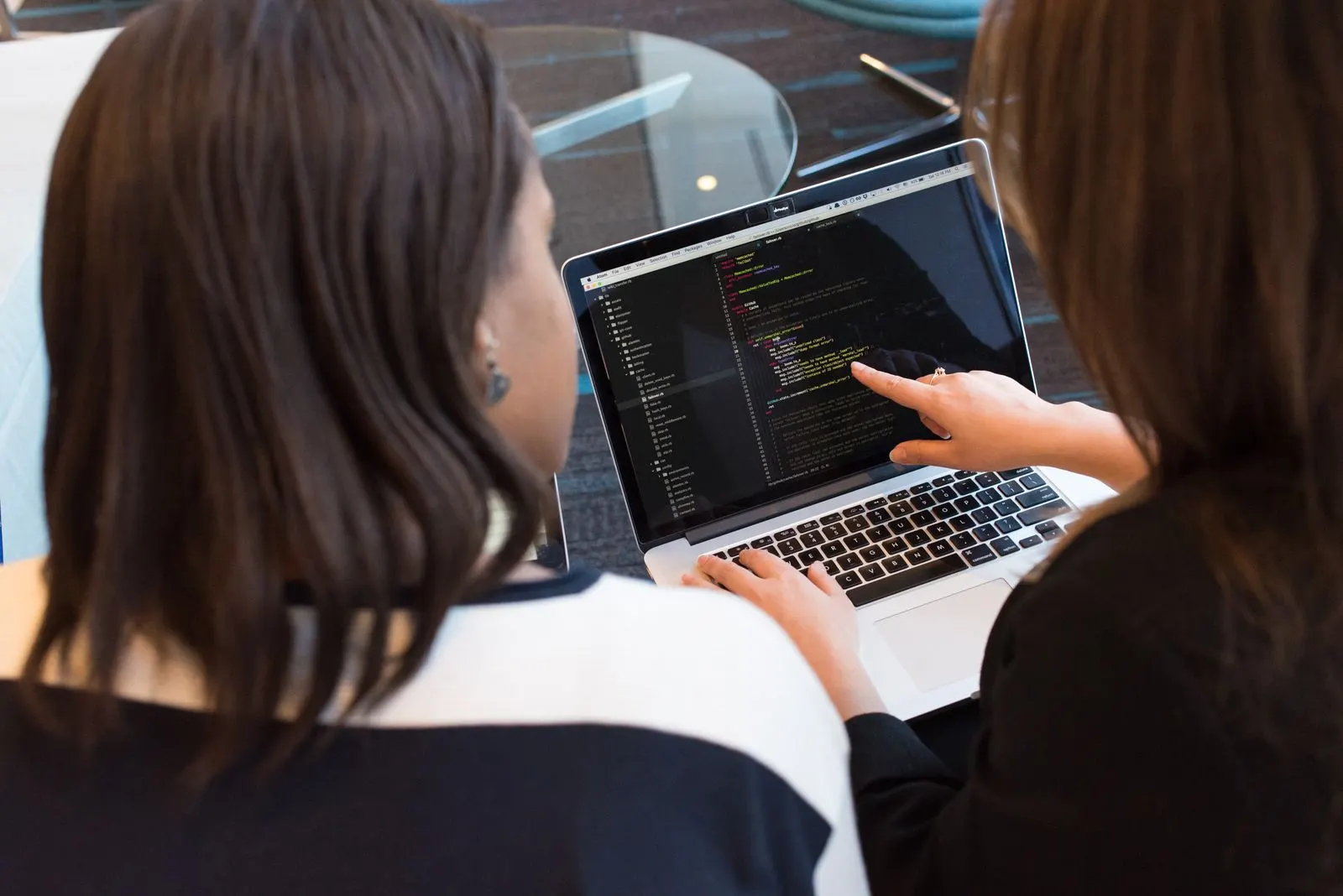 Closeup of structured code with HTML-like markup on a dark screen