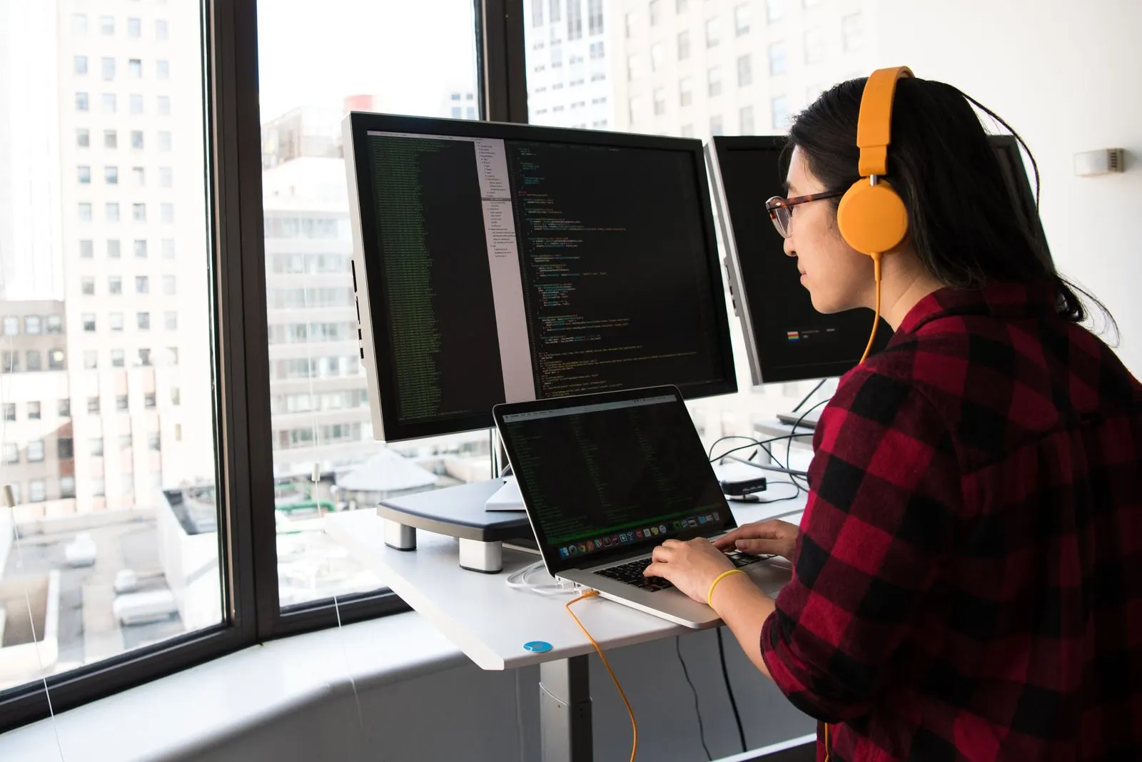 Black laptop with code representing agent loop architectures