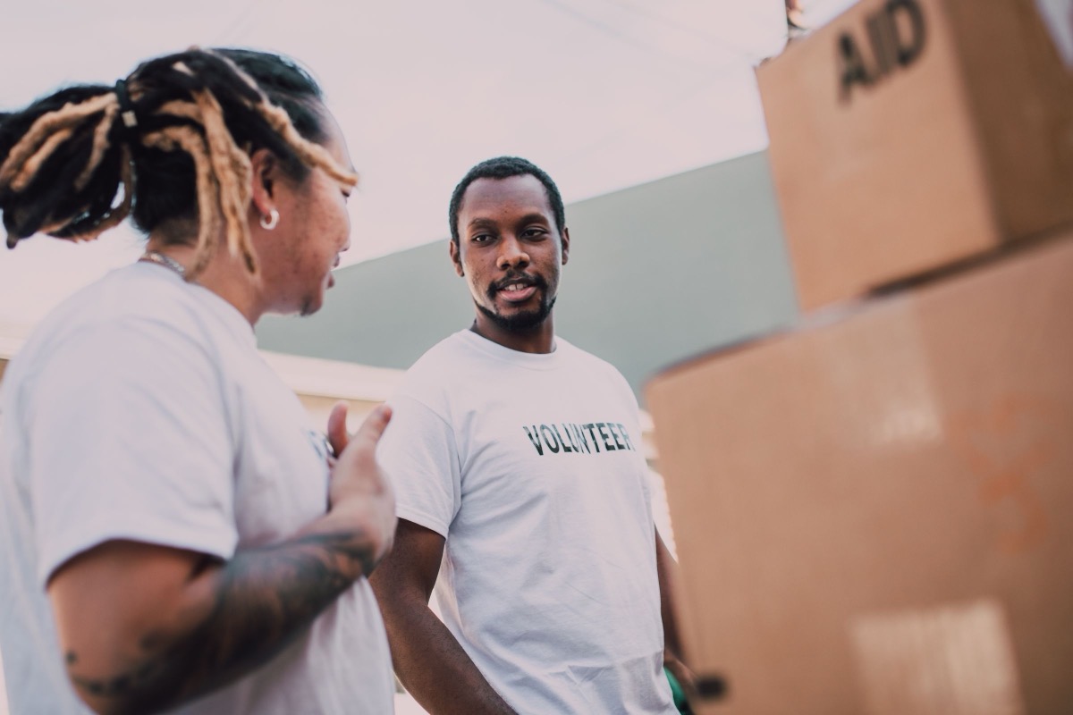 Volunteers sorting boxes of supplies together